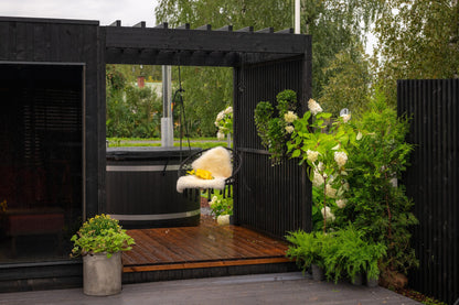 Nordic Misty Pergola alongside the sauna, planting in the foreground