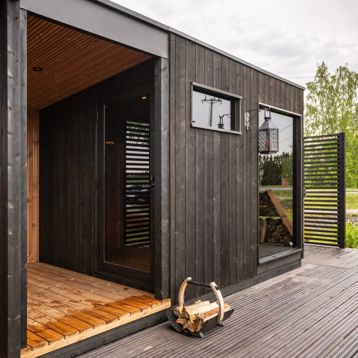 ThermaSol Nordic Misty outdoor sauna cabin on a timber deck in a garden