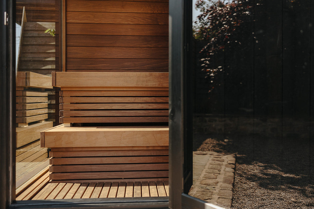 ThermaSol Nordic Misty interior, benches and the glazed wall looking out