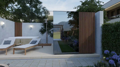 ThermaSol Ombra outdoor sauna cabin, mirror glass front and ribbed wood door, in a walled courtyard