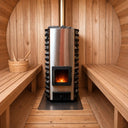 Pellum P47 pellet sauna stove with chimney installed inside a cedar barrel sauna