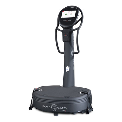 Power Plate my8 whole body vibration platform in matte black, with its touchscreen showing Quickstart and my8 Programs