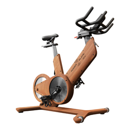 Power Plate REV vibration exercise bike in the wood finish