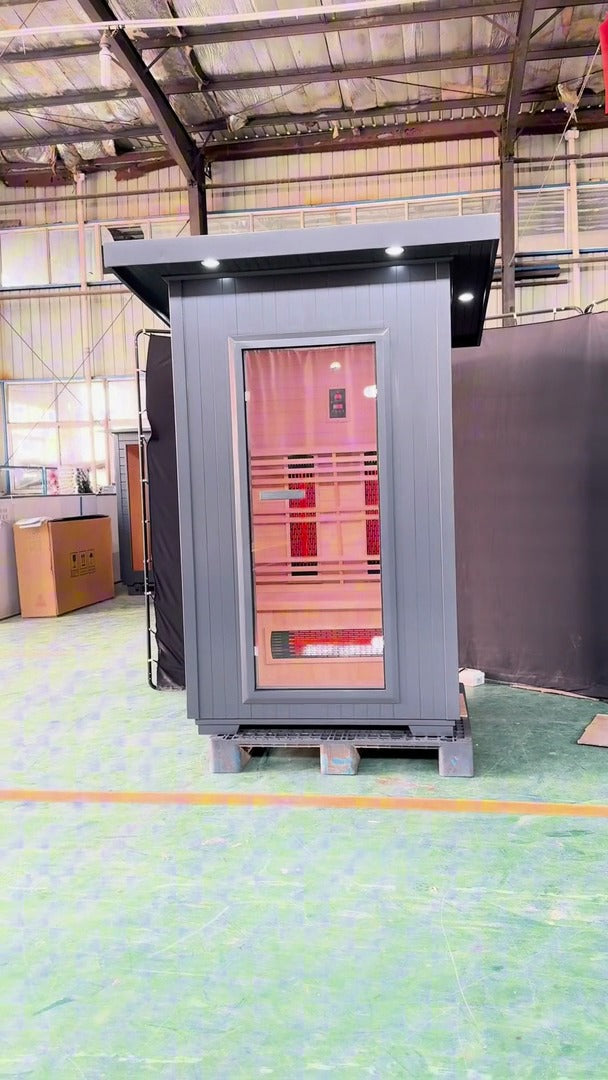 SunRay Logan outdoor infrared sauna walkaround film: gray flat roof cabin with a full glass door, then the infrared heaters, bench and ceiling lights inside