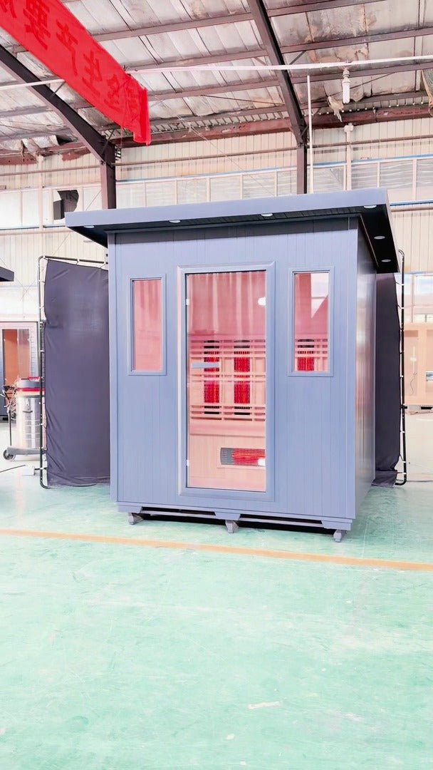 SunRay Pacific outdoor infrared sauna walkaround film: gray flat roof cabin with a glass door and two front windows, then the infrared heaters and benches inside
