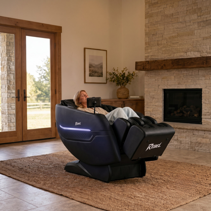 Rebel 4D massage chair — couple relaxing in home recovery space