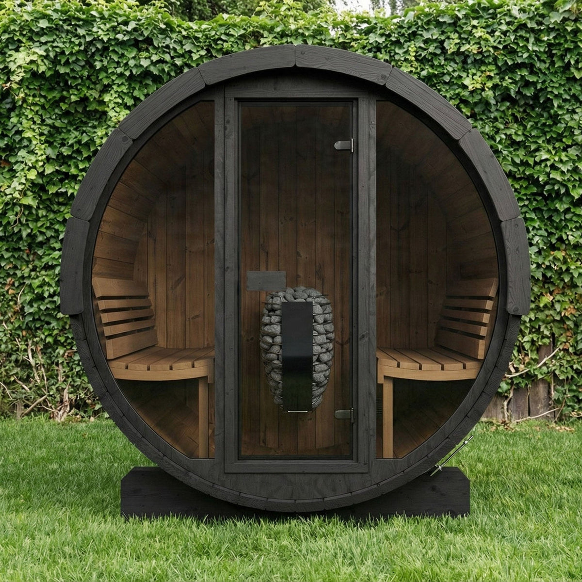SaunaLife E7G Ergo Series 4-Person Outdoor Barrel Sauna Kit, Glass Front, black finish, in a garden at night