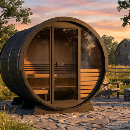 SaunaLife EE6G Ergo Elegance 4-Person Outdoor Barrel Sauna Kit, Glass Front, black finish, in a meadow at sunset