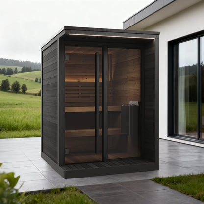 SaunaLife GL4 Garden Luxury 4-Person Outdoor Sauna Kit, black finish, on a patio beside a modern house