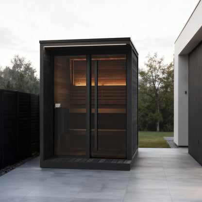 SaunaLife GL4 Garden Luxury 4-Person Outdoor Sauna Kit, black finish, in a side alley with a slatted fence