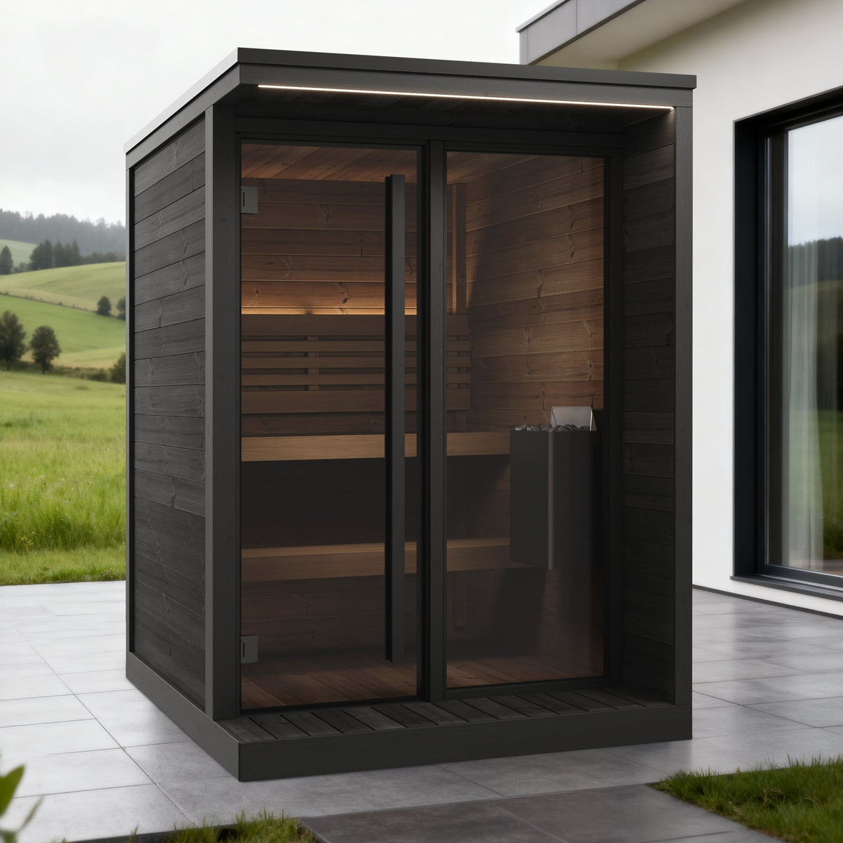 SaunaLife GL4 Garden Luxury 4-Person Outdoor Sauna Kit, black finish, on a patio beside a modern house