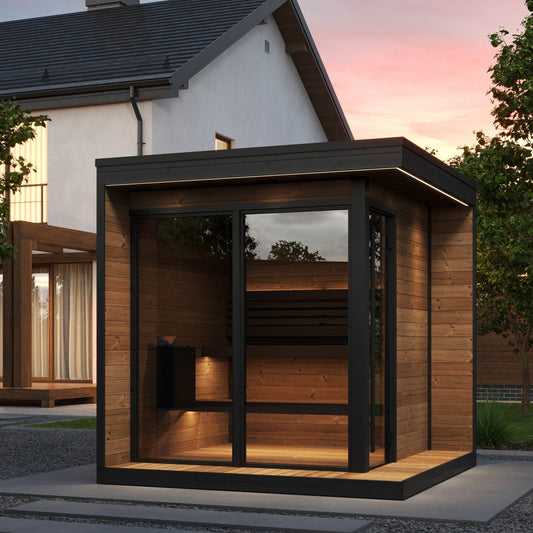 SaunaLife GL6 Garden Luxury 6 person outdoor sauna beside a house at dusk