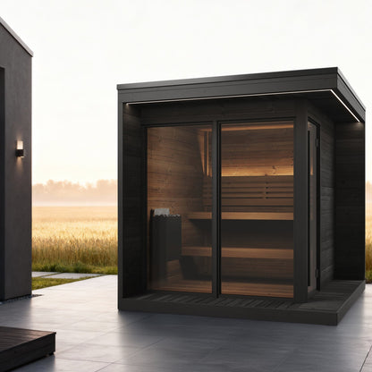 SaunaLife GL6 Garden Luxury 6-Person Outdoor Sauna Kit, black finish, on a patio at dawn