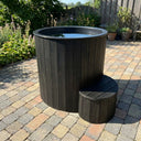 SaunaLife S1 Soak Series 1-Person Cold Plunge Tub, installed in a garden
