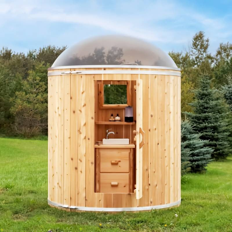 Skylight Washroom and Shower Combo in standard knotty cedar on a lawn, door open to the optional vanity, mirror and shelf under the dome.
