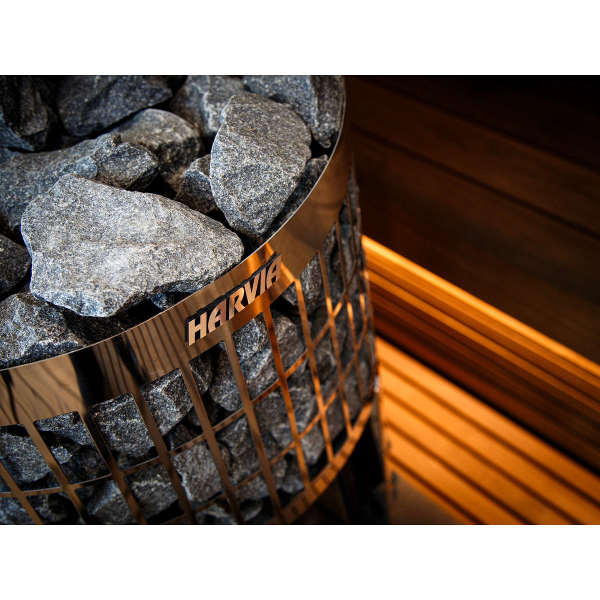 Close view of the stones and Harvia brand plate on the Cilindro wood stove