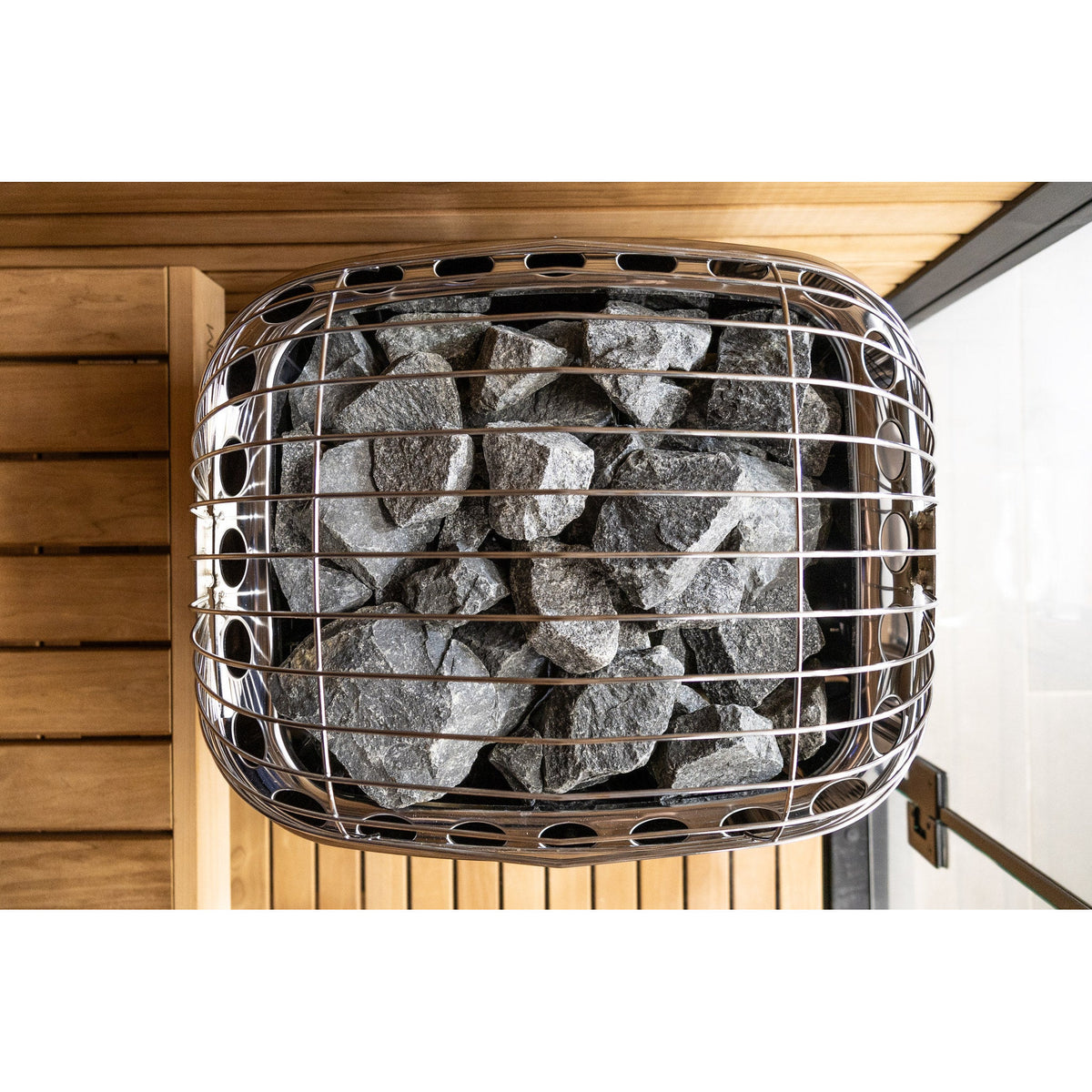 Harvia Club sauna heater from above, showing the full stone bed beneath the guard
