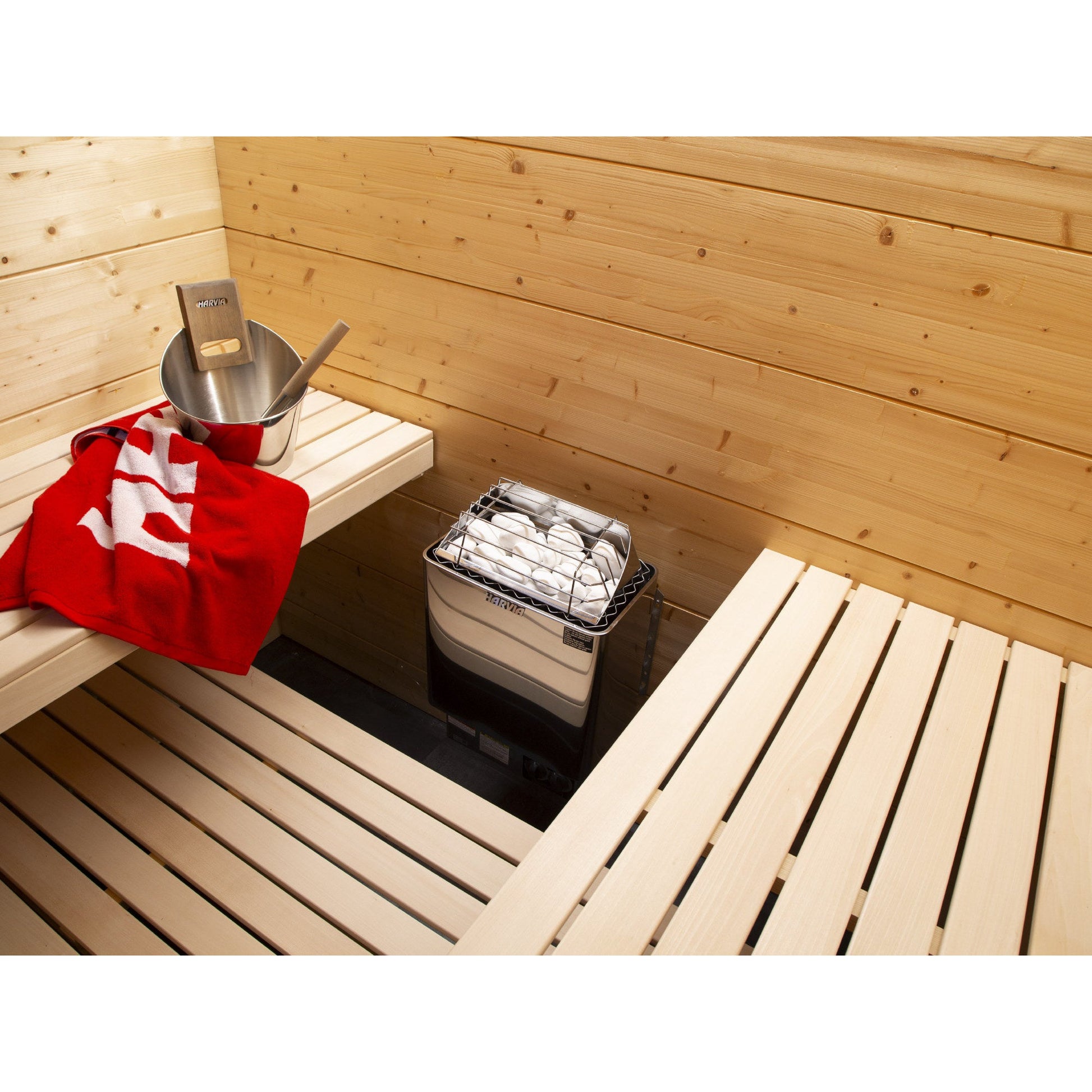 Harvia KIP sauna heater in use on the wall of a finished home sauna