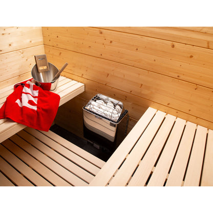 Harvia KIP W sauna heater mounted in a finished home sauna with timber benching