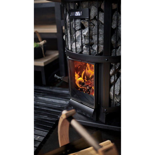 Harvia Legend 240 GreenFlame wood-burning sauna stove with the fire lit