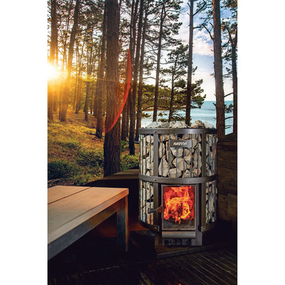 Harvia Legend wood-burning stove in an outdoor sauna with forest behind it