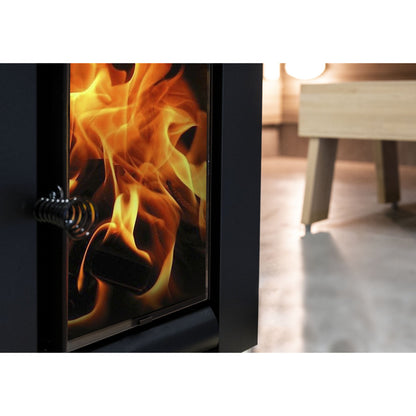 Fire seen through the glass door of a Harvia Linear wood-burning sauna stove