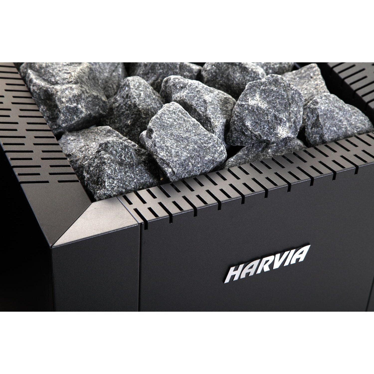 Harvia Linear wood stove from above, showing the stone bed and brand plate