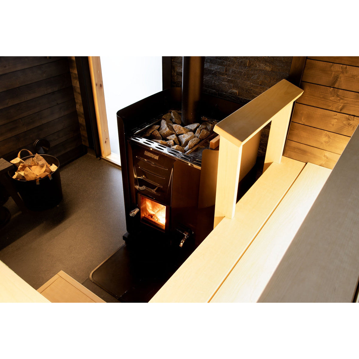 Close view of the Harvia Pro wood stove firebox with the fire lit