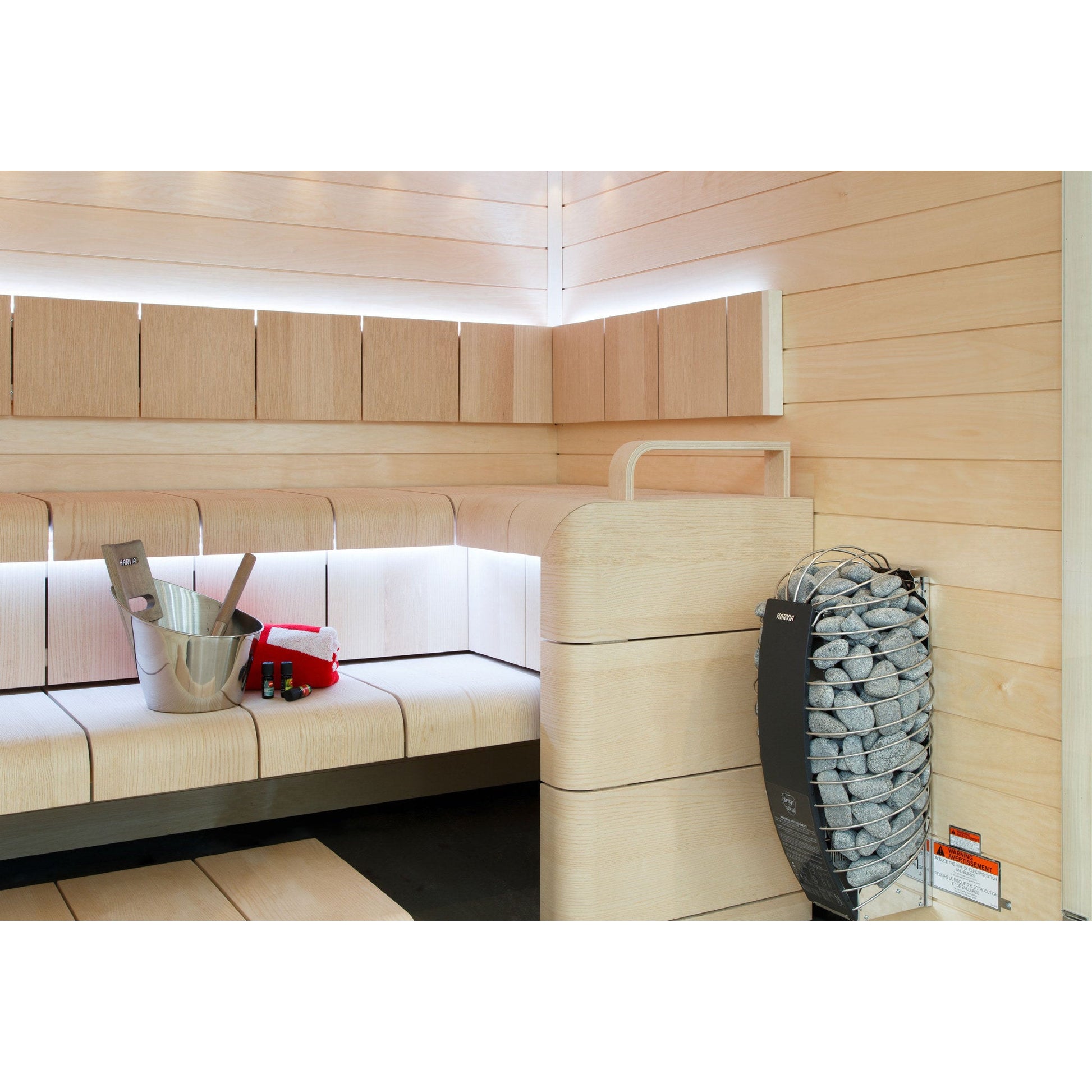 Harvia Spirit sauna heater mounted beside timber benching in a finished sauna
