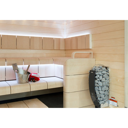 Harvia Spirit sauna heater mounted beside timber benching in a finished sauna