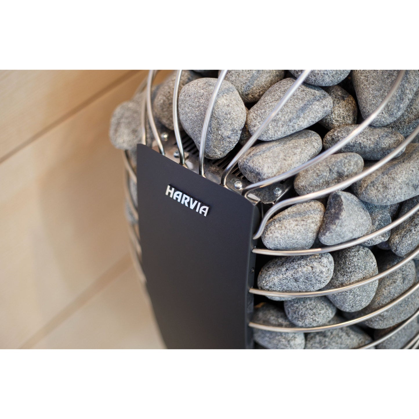 Close view of the Harvia Spirit stone cage and graphite black brand plate
