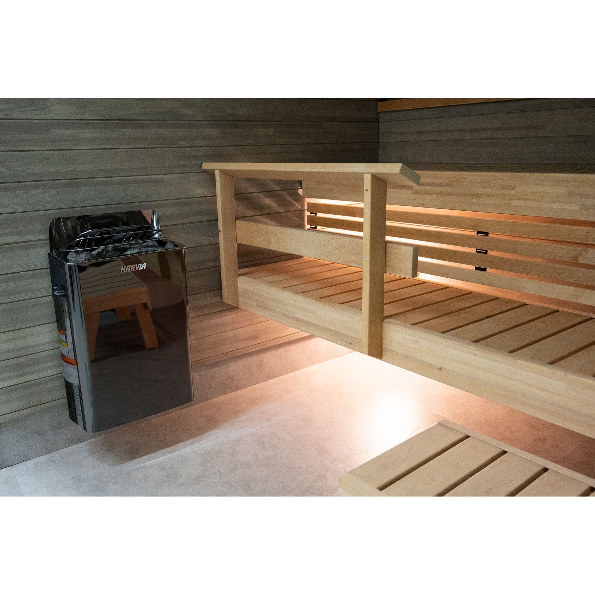 Harvia The Wall BlackSteel sauna heater mounted below the bench rail in a home sauna