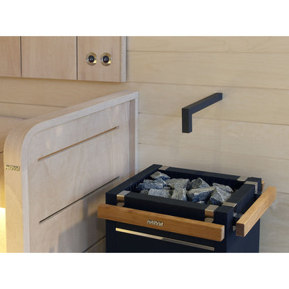 Harvia Virta sauna heater with its timber guard fitted, in a finished sauna room