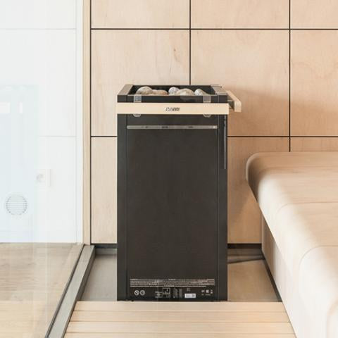 Harvia Virta HL90E electric sauna heater installed in a finished sauna room