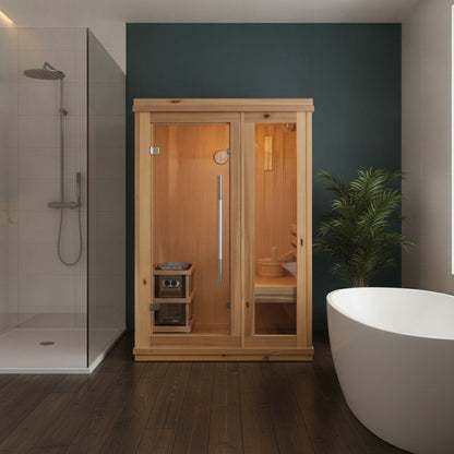 SunRay Aston 1-2 person indoor sauna in cedar against a dark teal wall on a dark wood floor, with a potted palm beside it