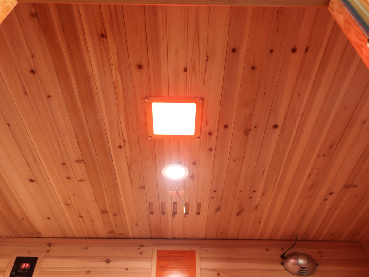 SunRay Cayenne ceiling with its light panel and round light, above the control panel