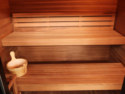 Upper and lower benches with backrest inside the SunRay Cayman, bucket and ladle on the lower bench