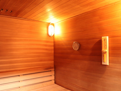 Wall light, hygrometer, sand timer and ceiling vents above the backrest inside the SunRay Cayman