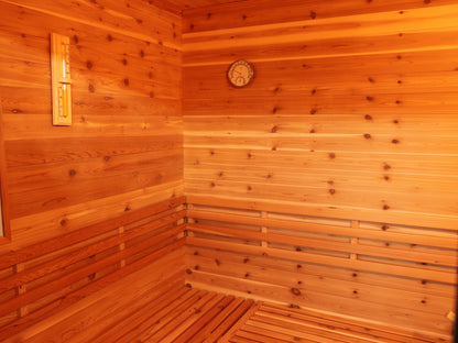 Corner inside the SunRay Denali with the sand timer, hygrometer and backrest above the L-shaped bench