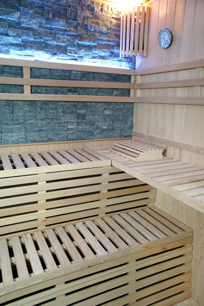 L-shaped upper bench with headrest above the lower bench inside the SunRay Galaxie, below the lit stone wall, slatted wall light and hygrometer