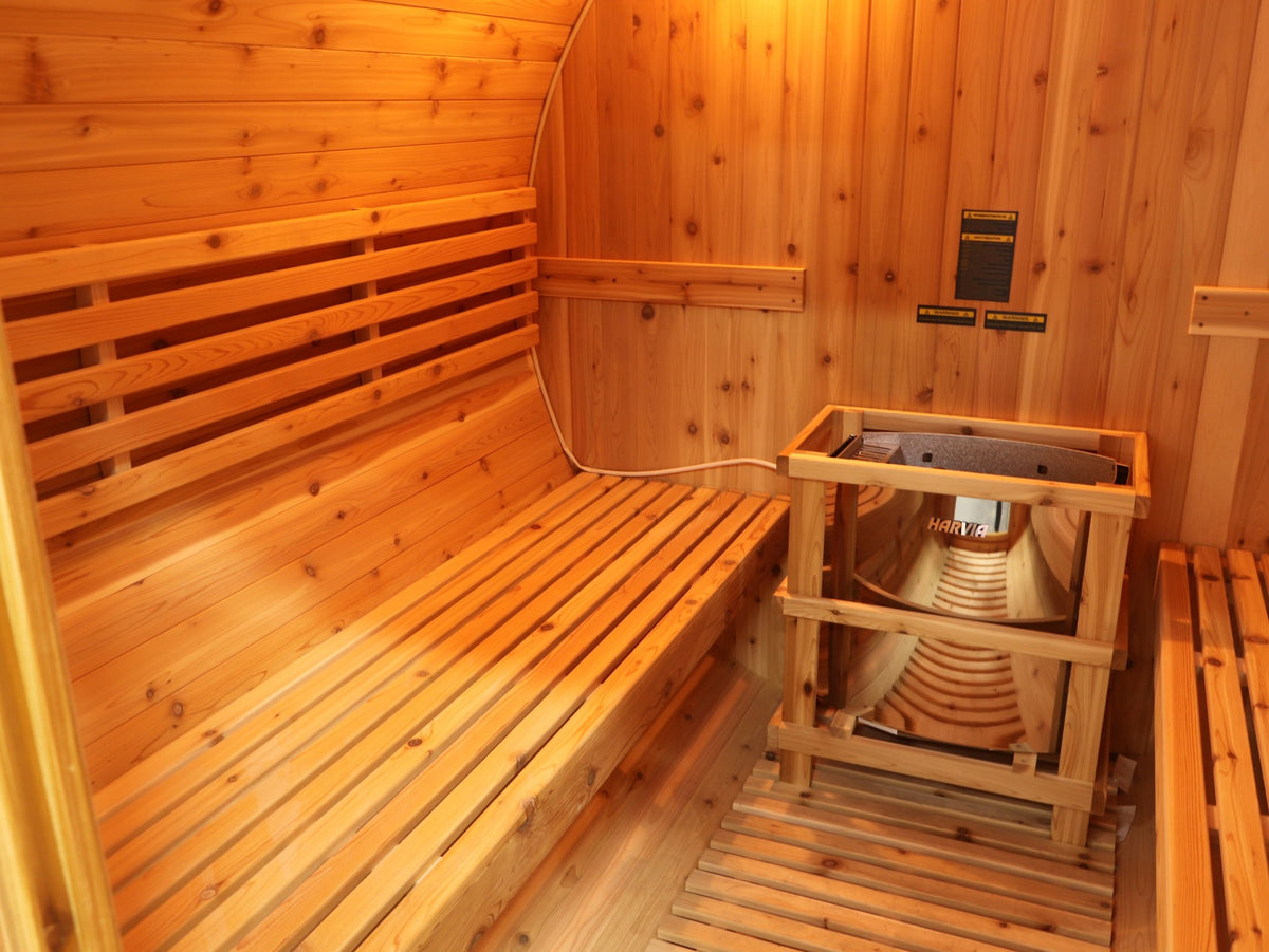One of the long cedar benches with its backrest running the length of the SunRay Galley, heater in its guard rail at the end
