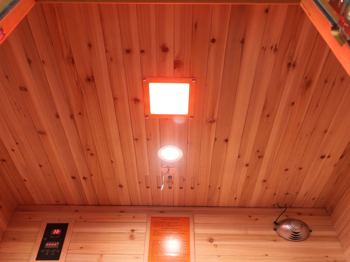 SunRay Grandby ceiling with its light panel and round light, above the control panel