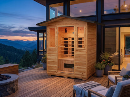 SunRay Grandby outdoor infrared sauna on a wooden deck beside a modern house at dusk, with a fire pit and lounge chairs