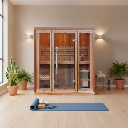 SunRay Hampton indoor sauna in a yoga studio, front view with lit interior, flanked by plants and wall lights