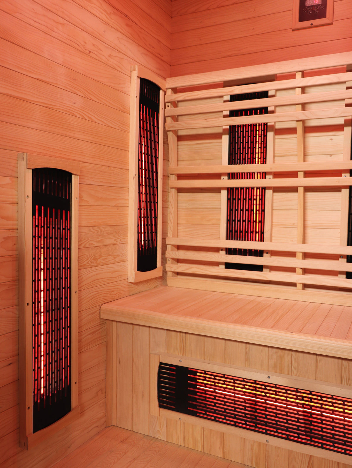 Corner of the SunRay Logan interior with infrared panels on the side wall, the back wall and the bench front