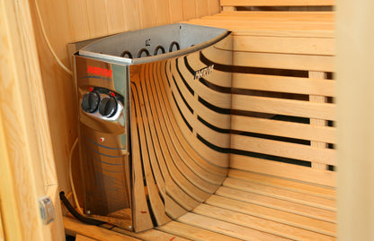 Harvia heater with two control dials on its front, set in a corner beside the bench inside the SunRay Southport