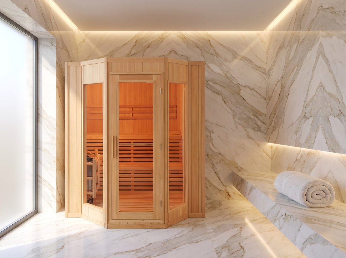 SunRay Tiburon 4-person indoor sauna in a marble spa room with cove lighting, angled glass front and lit interior