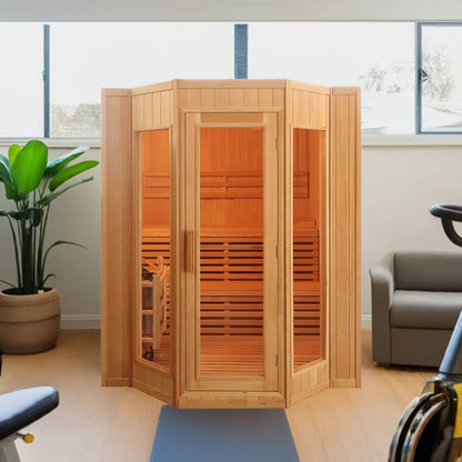 SunRay Tiburon indoor sauna in a home gym, angled glass front with the two-tier benches visible inside