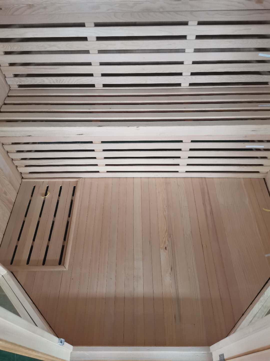 Looking down into the SunRay Tiburon: floor, two-tier benches and the angled front corners