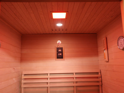Back wall inside the SunRay Waverly: backrest, control panel, sand timer, hygrometer and ceiling lights (interior shared with the Freeport)